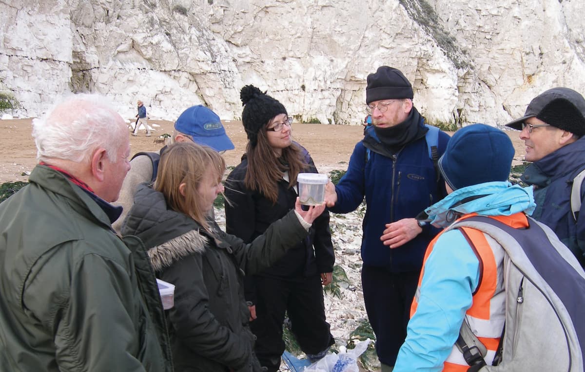 A group of people standing next to each other