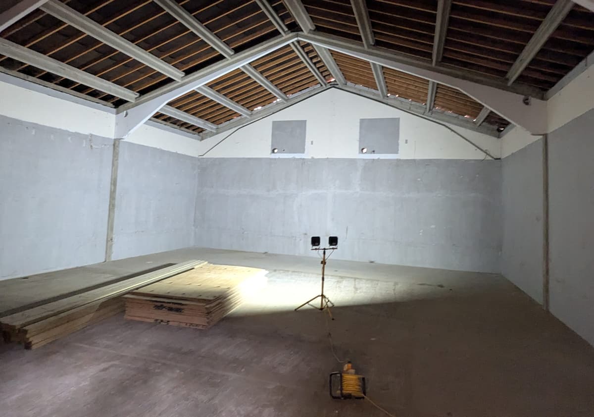 A large room with a ceiling made of wood