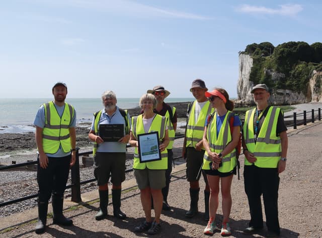 A group of people standing next to each other