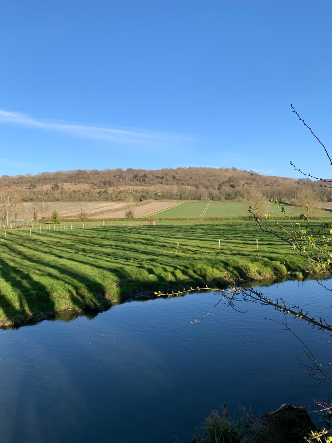 A river running through a lush green countryside