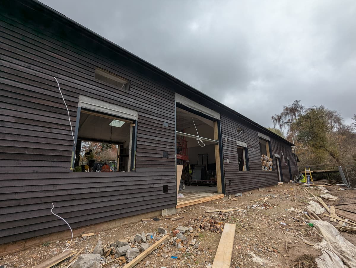 A house with a lot of windows on the side of it